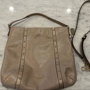 Gold Coach bag with cross-body strap